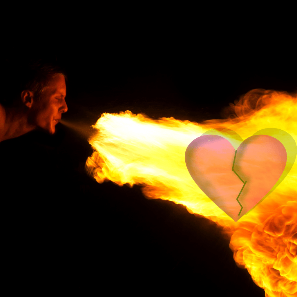 person breathing fire at a broken heart